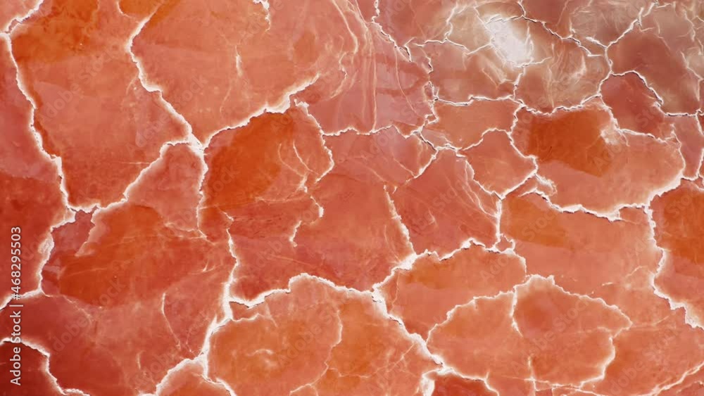 Cinematic overhead orange nature texture looks like meat or prosciutto ham. Beautiful scenic natural background 4K USA.Amazing red pattern top down aerial background with white salt surface texture Cinematic overhead orange nature texture looks like meat or prosciutto ham. Beautiful scenic natural background 4K USA.Amazing red pattern top down aerial background with white salt surface texture