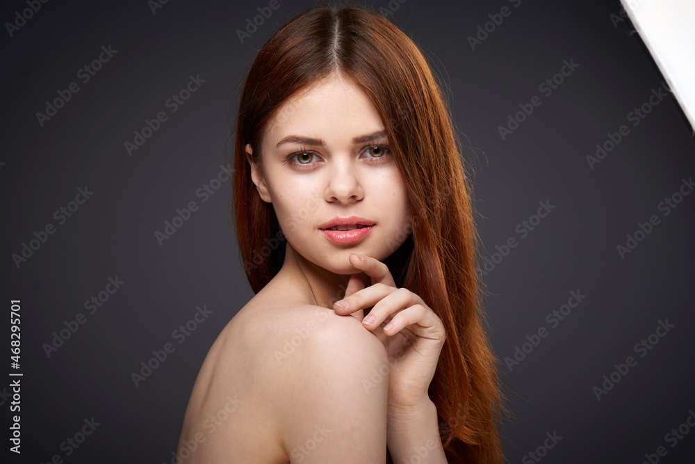 woman with bare shoulders and beautiful hairstyle close-up attractive look woman with bare shoulders and beautiful hairstyle close-up attractive look