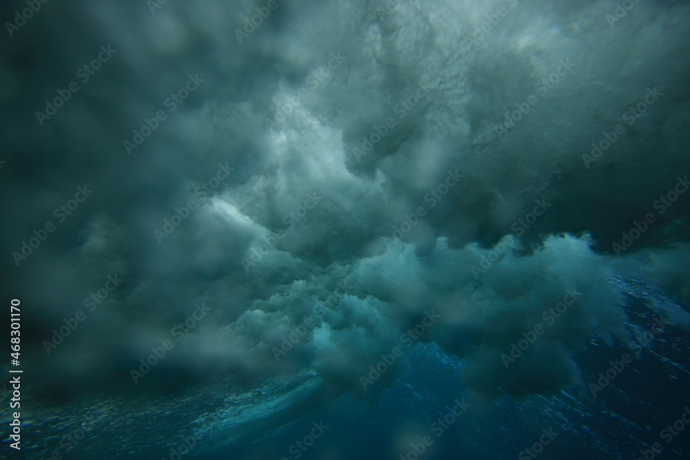 wave breaking viewed from underwater