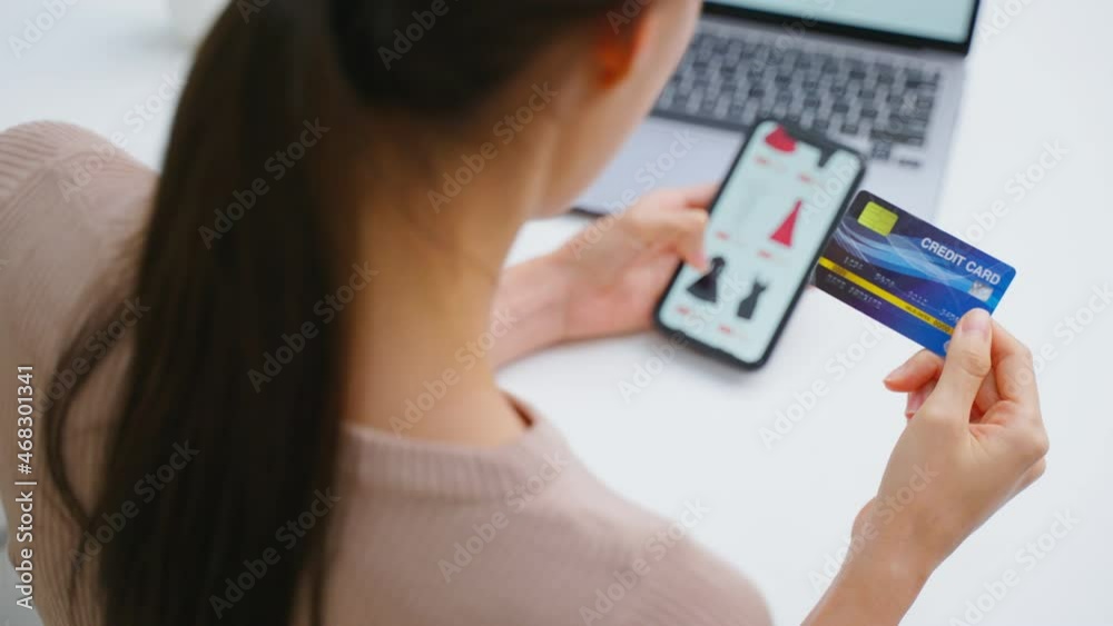 Close up of Asian young woman using mobile phone for shopping online. Close up of Asian young woman using mobile phone for shopping online.