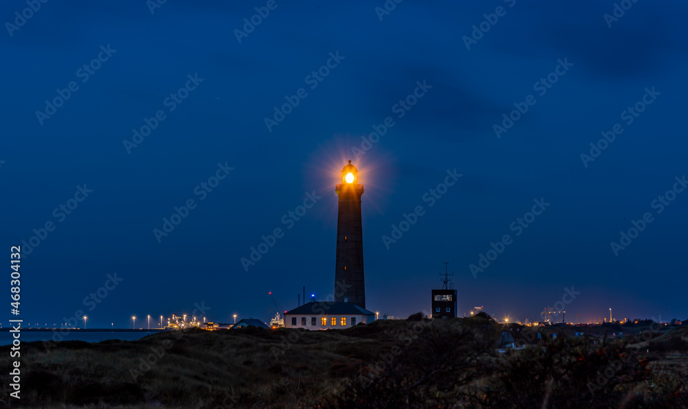 The famous Skagen Gray Lighthouse at the top of denmark with colorful sunset light. Relax evening ocean walk. wonderful travel place in Europe and scandinavia. Skagen
