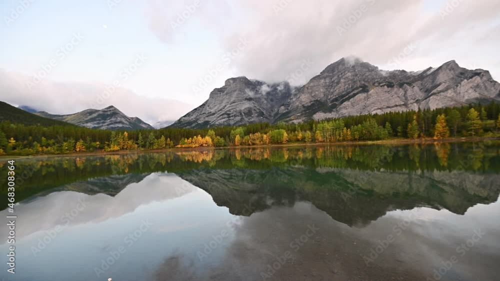 Rocky Mountains reflection on Wedge Pond in morning at Kananaskis country Rocky Mountains reflection on Wedge Pond in morning at Kananaskis country