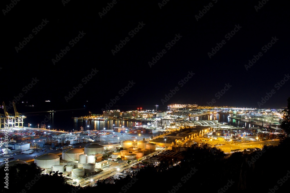 Industrial area of the port of Barcelona at night. View from Montjuic mountain.