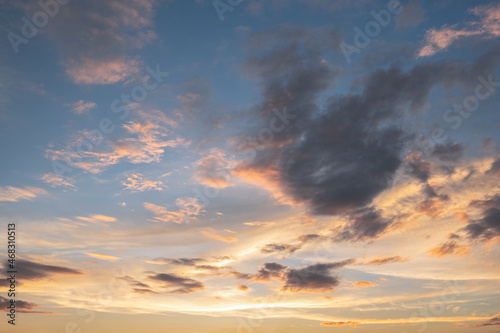 Colorful sunset and sunrise with clouds.Blue and orange color of nature.Many white clouds in the blue sky.The weather is clear today.sunset in the clouds.The sky is twilight. © gexphos