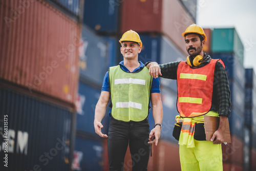 Two young male workers wear...