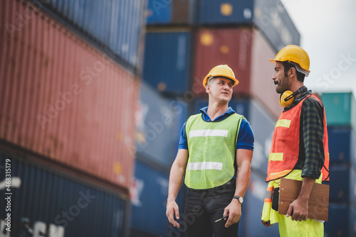 Two young male workers wear...
