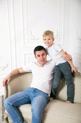 Happy father and son in   bright home interior. © DariaTrofimova
