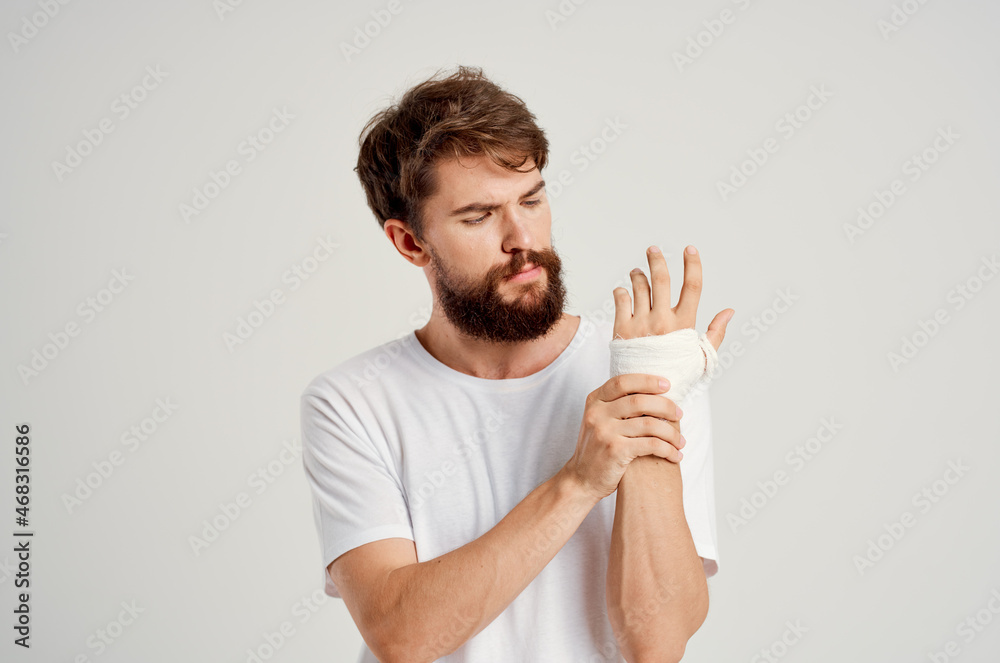 sick man bandaged hand injury to fingers hospitalization hospital medicine