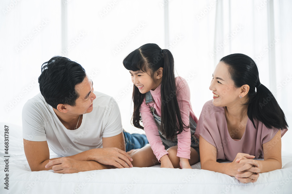 happy love family lifestyle with Asian father and mother and child daughter at home together happy love family lifestyle with Asian father and mother and child daughter at home together