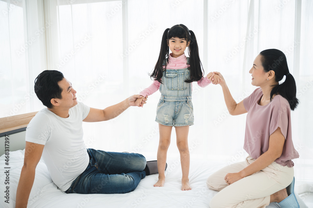 happy love family lifestyle with Asian father and mother and child daughter at home together happy love family lifestyle with Asian father and mother and child daughter at home together