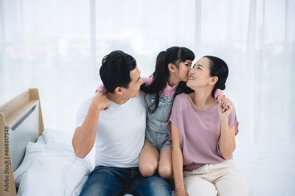 happy love family lifestyle with Asian father and mother and child daughter at home together happy love family lifestyle with Asian father and mother and child daughter at home together