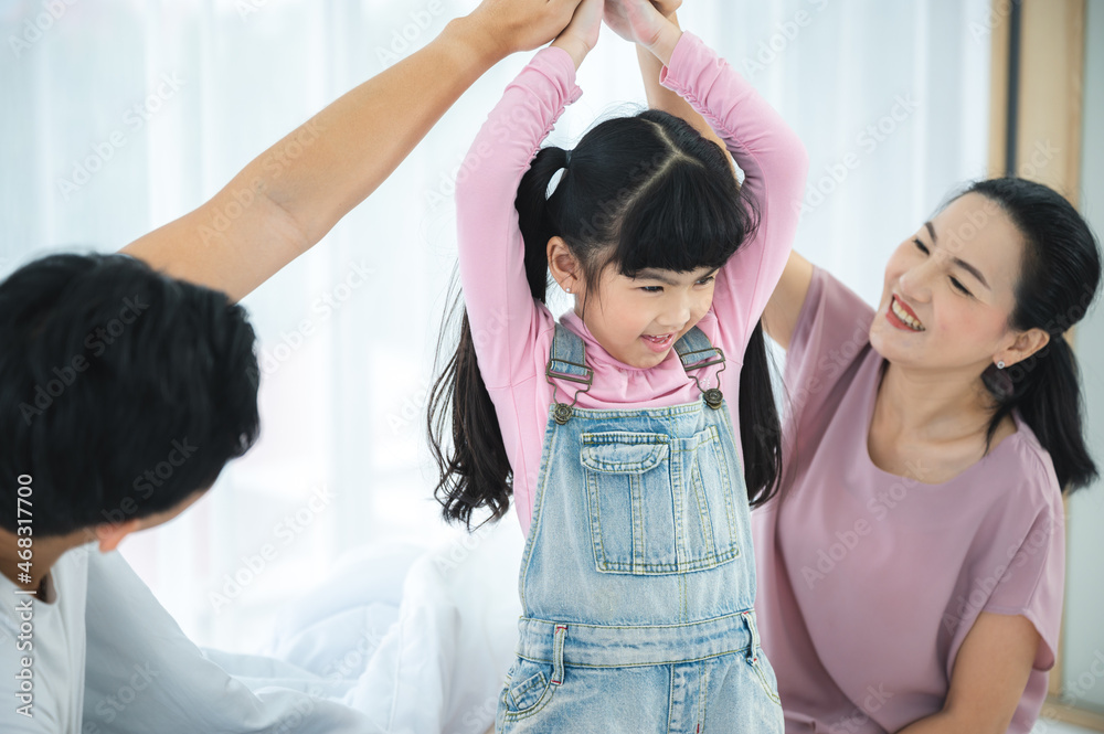 happy love family lifestyle with Asian father and mother and child daughter at home together happy love family lifestyle with Asian father and mother and child daughter at home together
