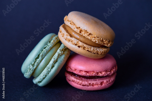 colorful macaroons on a wooden table