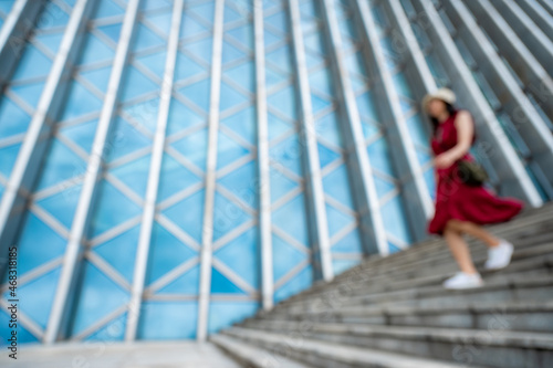 Asian woman in red dress at modern building, female girl with urban city lifestyle © chokniti