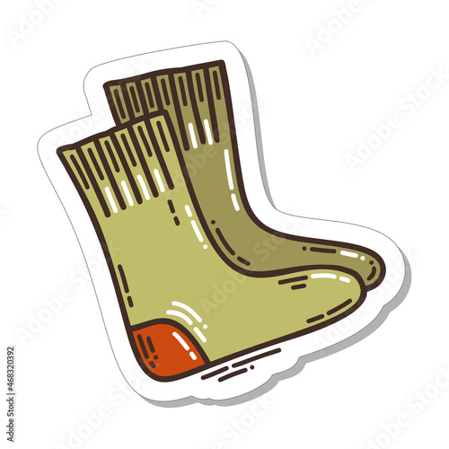 Colorful hand-drawn cold days mood sticker with wooly socks in doodle style isolated on white background. Cute vector for seasonal decoration.