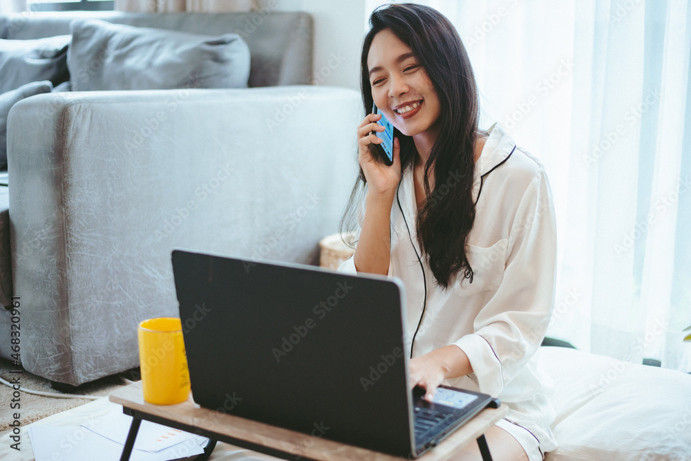 young Asian woman freelance working business work on laptop at home, working from home concept young Asian woman freelance working business work on laptop at home, working from home concept