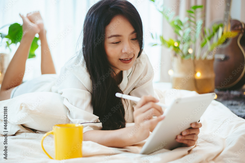 young Asian woman using laptop computer to business online work, female freelance working from home by using internet cyberspace communication technology for businesswoman job young Asian woman using laptop computer to business online work, female freelance working from home by using internet cyberspace communication technology for businesswoman job