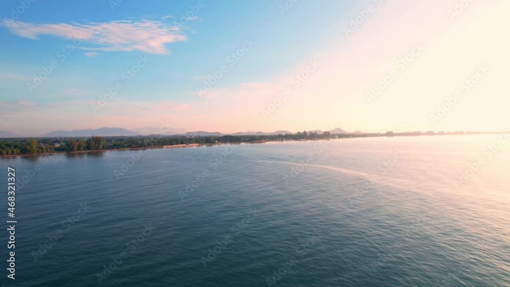 4K Aerial view of drone move on beautiful sea, the morning sunlight reflecting on the waves. Dynamic aerial shot. Perfect for holiday summer background. Drone 4k shot.
4K Aerial view of drone move on beautiful sea, the morning sunlight reflecting on the waves. Dynamic aerial shot. Perfect for holiday summer background. Drone 4k shot.