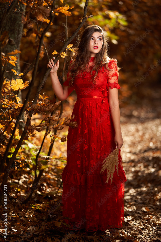 Woman in red dress in the oak forest, full body Woman in red dress in the oak forest, full body
