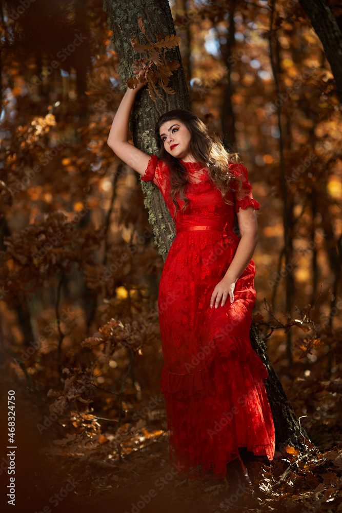 Woman in red dress in the oak forest, full body Woman in red dress in the oak forest, full body