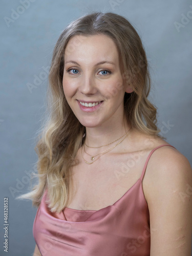 portrait of actress and director Yanna Mazazolina on a gray-blue background