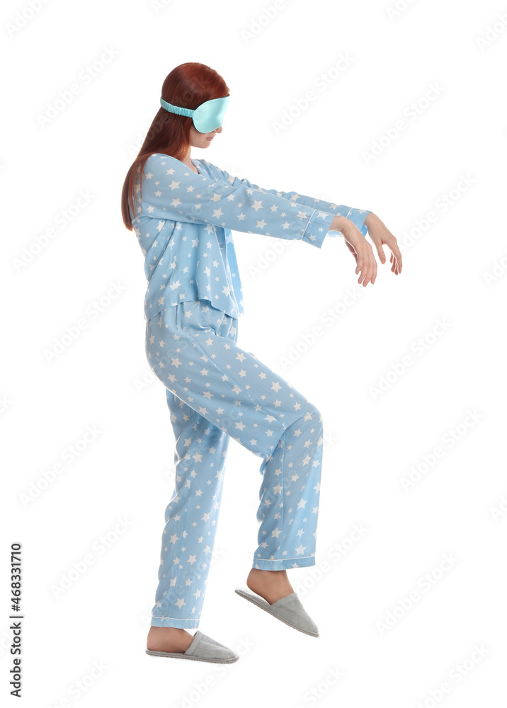 Young woman wearing pajamas, mask and slippers in sleepwalking state on white background Young woman wearing pajamas, mask and slippers in sleepwalking state on white background