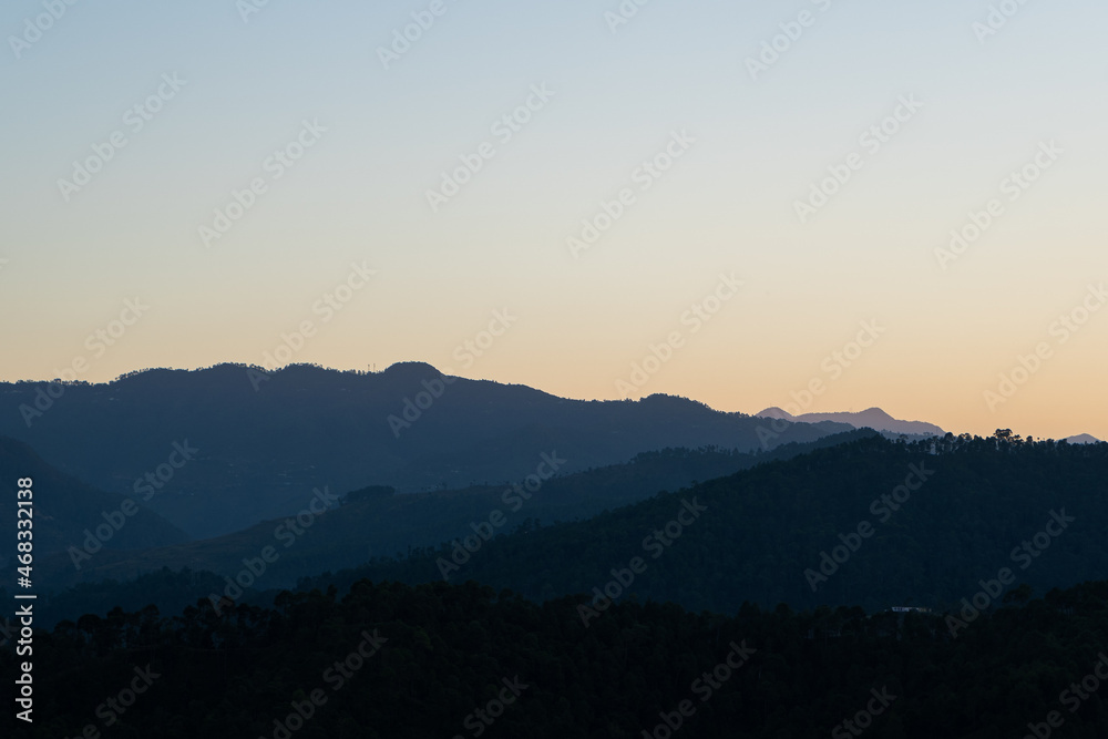 beautiful view of layers of mountains during sunset