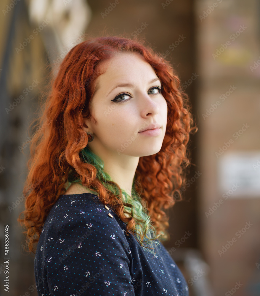 Fototapeta premium Portrait of a beautiful redhead girl.