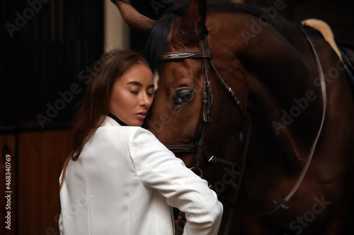 portrait beautiful woman long hair next horse © Georgii