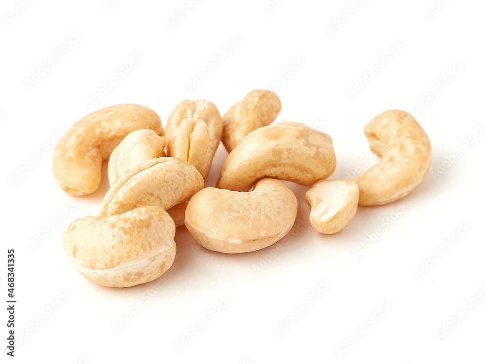Roasted cashew nuts isolated on white background. Roasted cashew nuts isolated on white background.