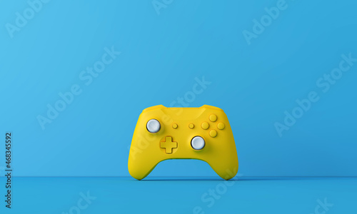 Bright yellow video game controller against a blue background. Gaming concept. 3D Rendering