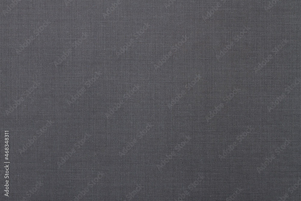 Grey fabric background with interlacing threads. Copy Space