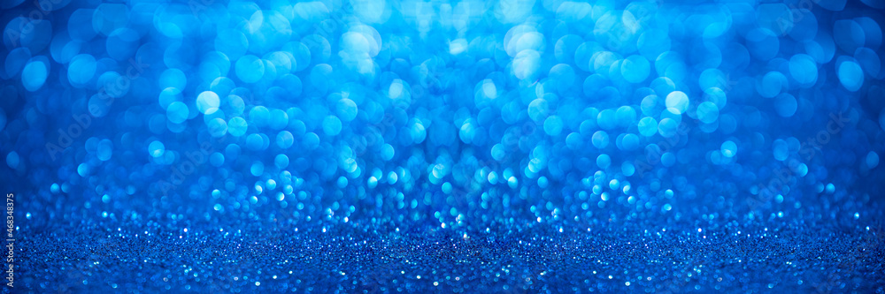 Blue sparkle background with bokeh.