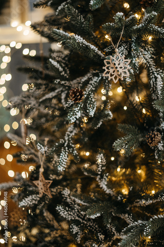 Christmas decorations hanging on fir tree. christmas tree detail © Oleksandr