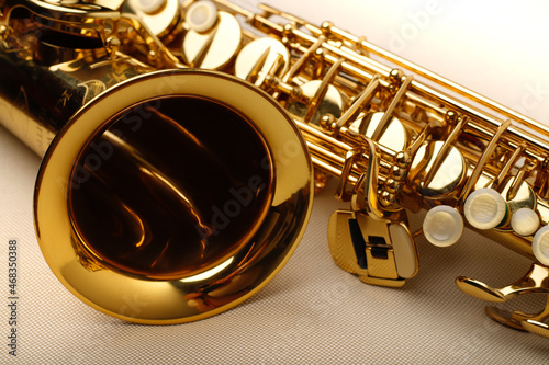 Alto saxophone close-up on white background photo