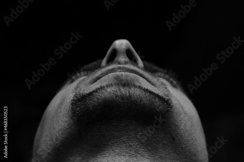 Photos Close up portrait of a bearded man, bottom view