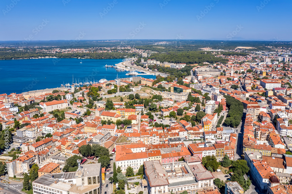 An amazing aerial view of Pula with amphitheatre and port, Istria, Croatia