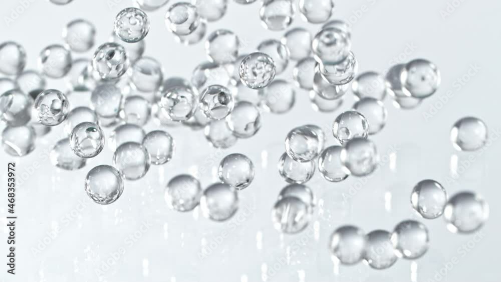Super Slow motion Shot of Hydrogel Balls Bouncing on Glass at 1000fps.