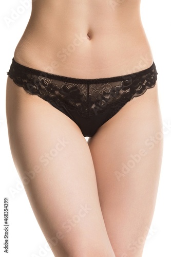 Canvastavla slim female body on a white background, panties, half-length shot
