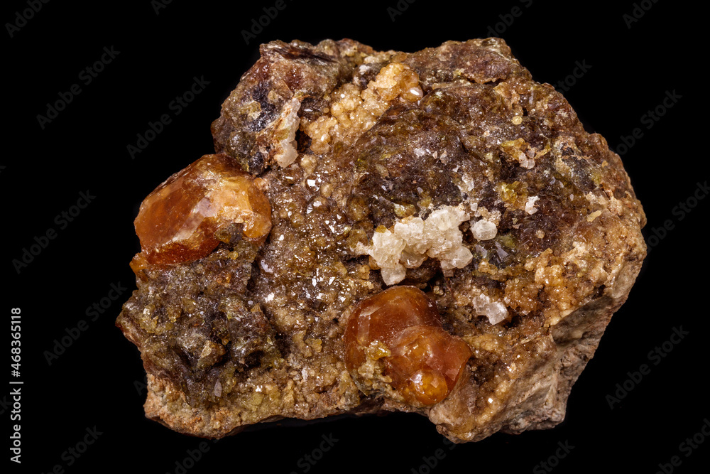 macro mineral stone Grossular, Garnet, Epidote on a black background macro mineral stone Grossular, Garnet, Epidote on a black background