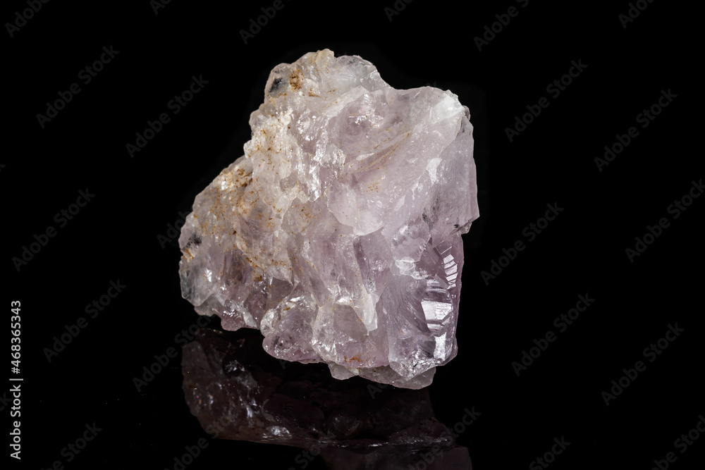 Macro mineral amethyst quartz stone on a black background