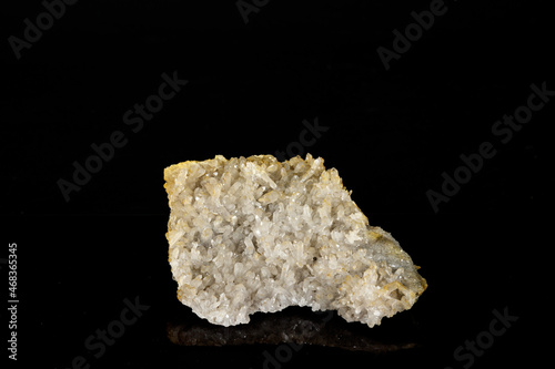 Macro mineral quartz stone on a black background