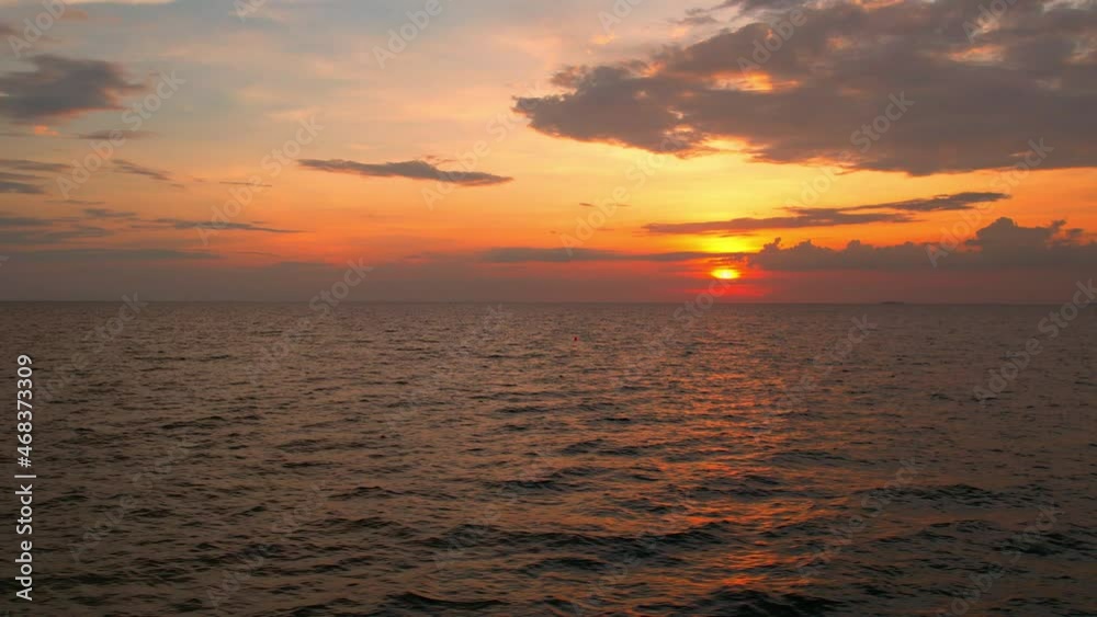 4K drone flying over the sea, sunset on the horizon. The orange and yellow light reflected in the beautiful sea waves. tropical sea in thailand
4K drone flying over the sea, sunset on the horizon. The orange and yellow light reflected in the beautiful sea waves. tropical sea in thailand