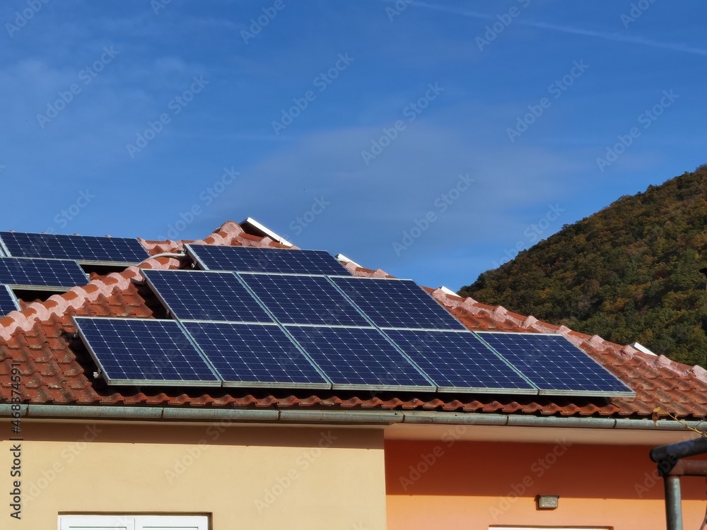solar panels on house roof, forest for background , electricity ecology renewable energy solar panels on house roof, forest for background , electricity ecology renewable energy