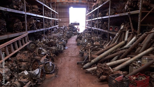 Salvage yard containing new, old, and rare cars, and trucks. Engine parts.