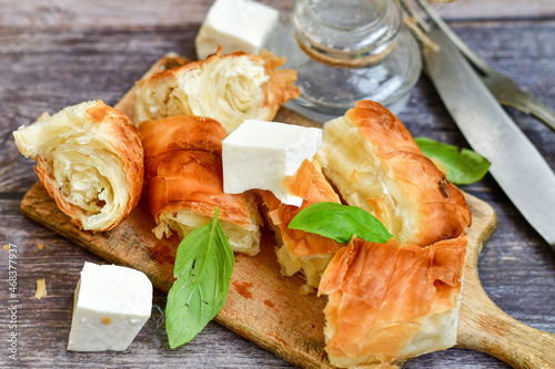 Bakery .Home made  cheese pie  with phyllo pastry and organic eggs. Traditional Bulgarian banitsa with white  feta cheese photo