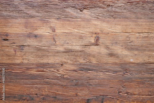 Фотография Textured walnut wooden table view from above