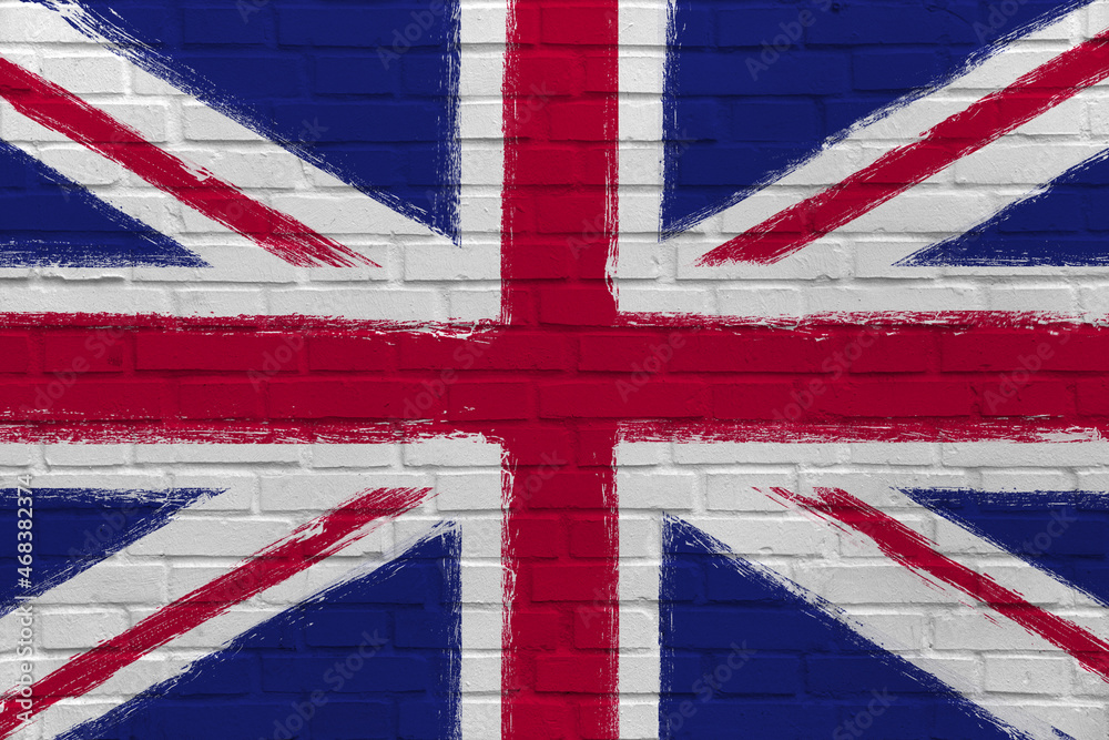 Fototapeta premium Flag of United Kingdom on Brick Wall. Artwork in grunge, urban and industrial style. British flag as graffiti graphic.