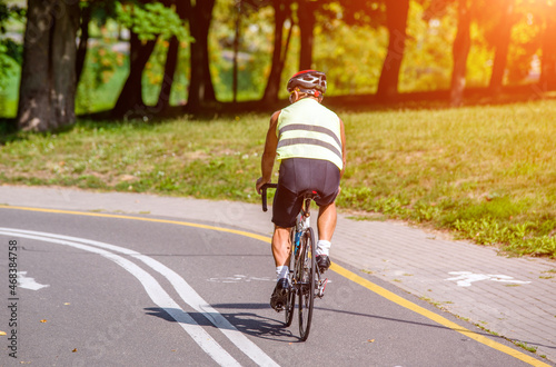 Cyclist ride on the bike path in the city Park 