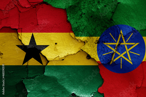 flags of Ghana and Ethiopia painted on cracked wall